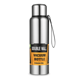 Matte black Stainless Steel Vacuum Bottle standing on a rock during a hike.