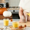 Pasabahce Rain textured glassware with golden pumpkin drink, kitchen counter scene