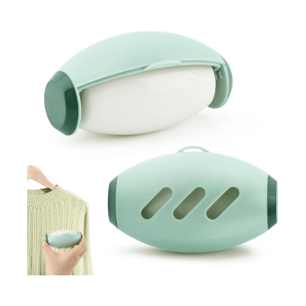 Green Washable Lint Roller being rinsed under water to remove pet hair.