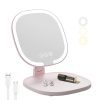 Pink Rechargeable LED Travel Makeup Mirror illuminated on a vanity table.