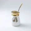 NASMA Series Porcelain Mate Cup – Feather Pattern & Gold Rim, on a white wall