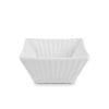 A single white ribbed square ceramic bowl.