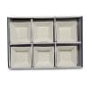 A set of 6 white ribbed square bowls inside their product packaging.
