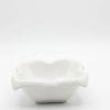 A single white flower-shaped ceramic bowl on a clean background.