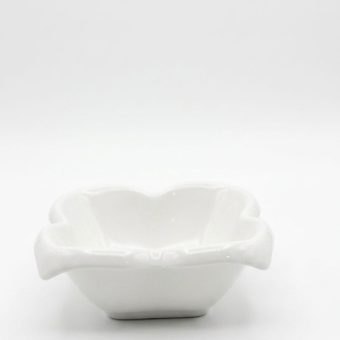 A single white flower-shaped ceramic bowl on a clean background.