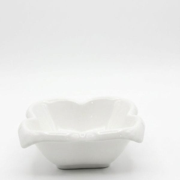 A single white flower-shaped ceramic bowl on a clean background.