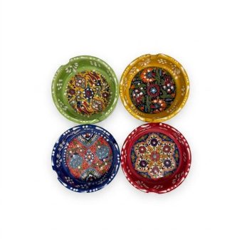 A collection of four 8 cm handcrafted ceramic ashtrays in red, green, blue, and yellow.
