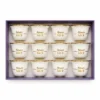 Set of 12 white Arabic coffee cups with gold rims and “صحة وهنا” printed in Arabic