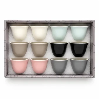 Gift box containing 12 ceramic Arabic coffee cups in assorted pastel, black and grey colors