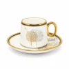 White porcelain espresso cup and saucer decorated with gold and silver trees and black-and-gold trim
