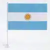 Argentina national car flag measuring 30 by 45 cm attached to a white plastic window clip pole, isolated on a white background.