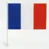 France national tricolor car flag measuring 30 by 45 cm mounted on a white window clip stand, isolated on a white background.