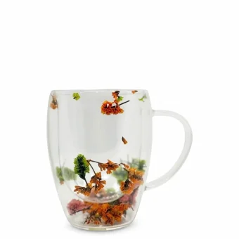 A double-walled glass mug with real preserved dried flowers inside the walls, displayed on a clean white background
