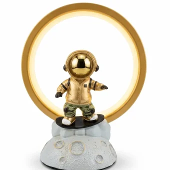 Front view of a detailed gold astronaut figurine inside a golden ring light,