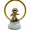 A close-up of an astronaut figurine on a lunar base inside a ring lamp,