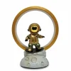 A full view of an astronaut lamp with a golden ring, perfect for modern desk decor,