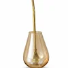 An elegant gold stainless steel bombilla inside a glass mate cup,