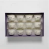 A 12-piece set of white ceramic Arabic coffee cups with gold 