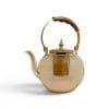 A side view of an elegant honey glass teapot featuring a gold infuser and a wooden handle