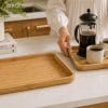 A Natural Bamboo Serving Tray set of 2 on a kitchen counter.