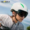 Woman wearing Nexera neck-mounted wireless earphones while cycling outdoors