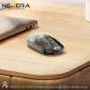 Nexera transparent wireless mouse on wooden desk beside laptop