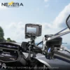 NEXERA NX-CAM02 sports camera mounted on a motorcycle handlebar while riding