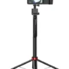 Hoco selfie stick tripod extended with a camera mounted, standing on tripod legs