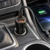 Reshunk dual port fast charger plugged into a vehicle socket and charging a smartphone through USB-C