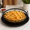 Verotti Round Air Fryer basket filled with crispy fries on a kitchen counter